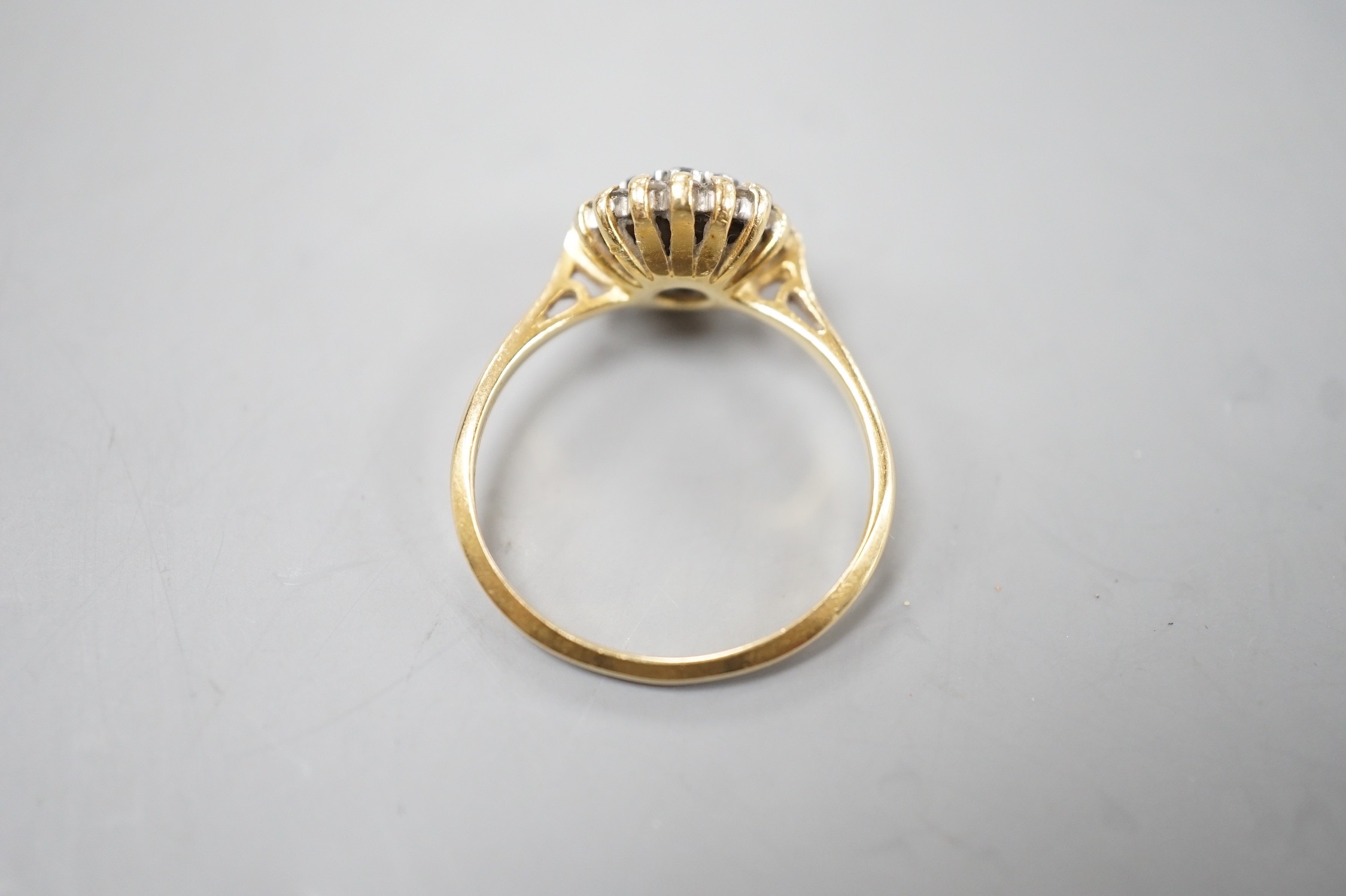 A 1960's 18ct gold, 18ct gold, sapphire and diamond set circular cluster ring, size O, gross weight 3.6 grams.